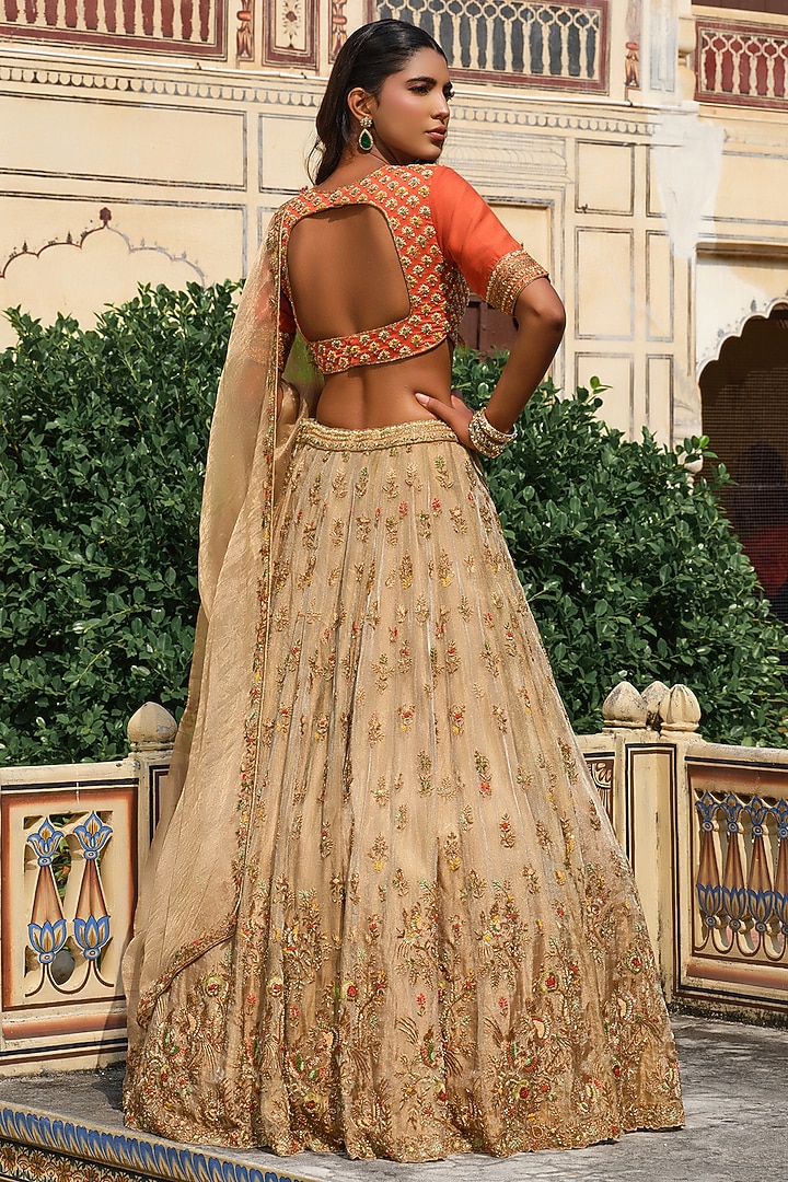 Gold Raw Silk Floral Hand Embroidered Bridal Lehenga Set by AMRIN KHAN at Pernia's Pop Up Shop