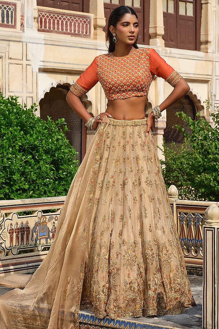 Gold Raw Silk Floral Hand Embroidered Bridal Lehenga Set by AMRIN KHAN at Pernia's Pop Up Shop