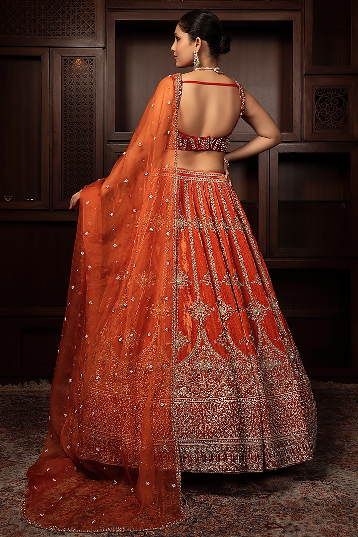 Orange Velvet Zardosi Embroidered Bridal Lehenga Set
by AMRIN KHAN at Pernia's Pop Up Shop