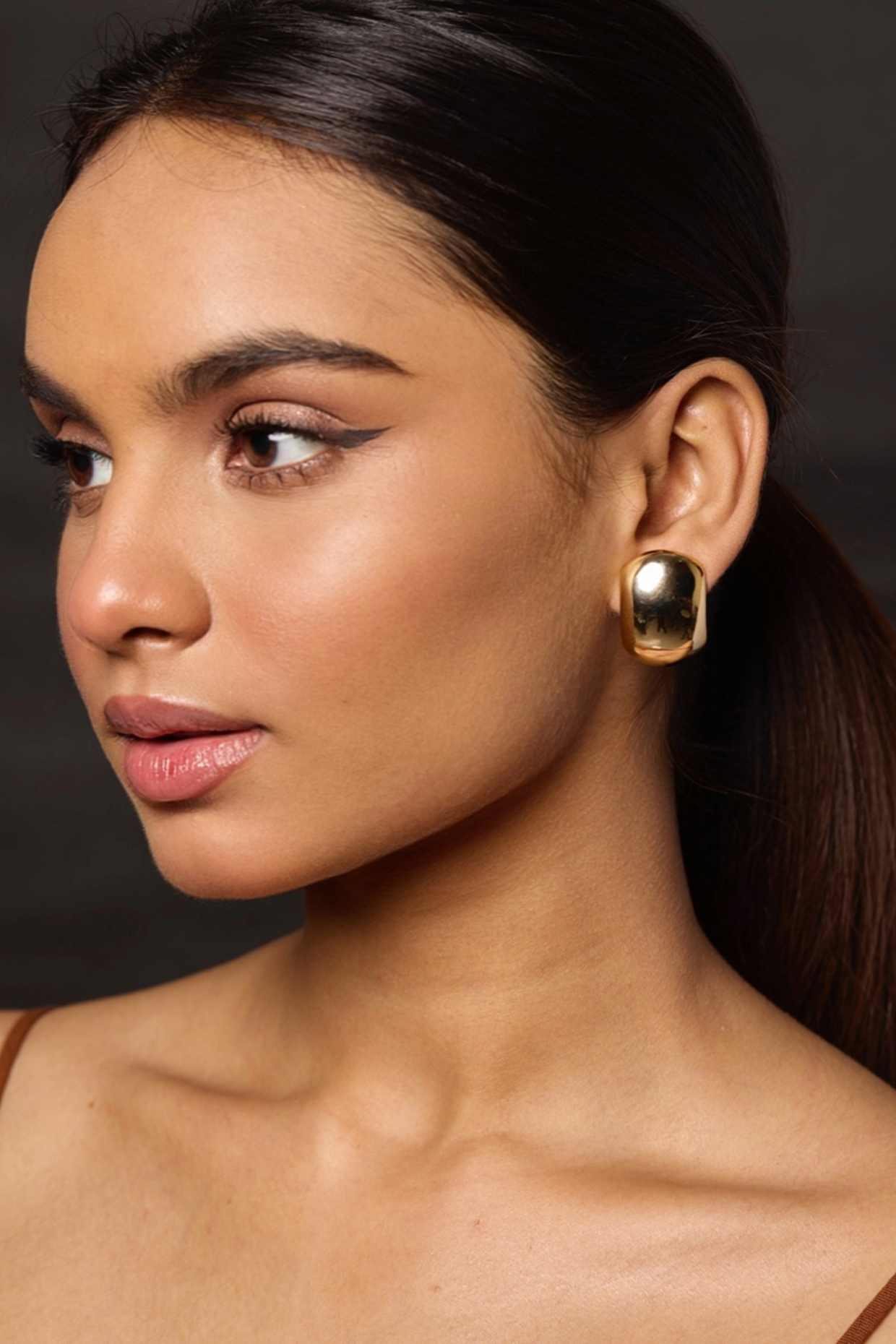 Gold Finish Statement Stud Earrings by Amreli Jaipur at Pernia's Pop Up Shop