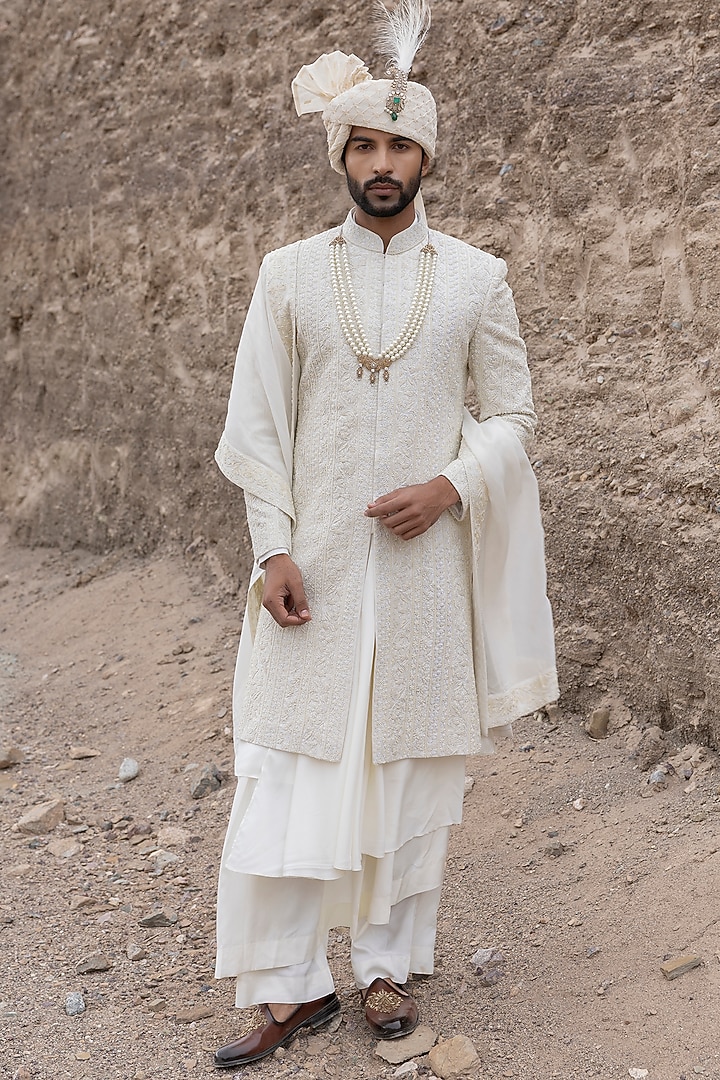 Cream Textured Poly Knit Hand Embroidered Groom Sherwani Set by AMIT ARORA at Pernia's Pop Up Shop