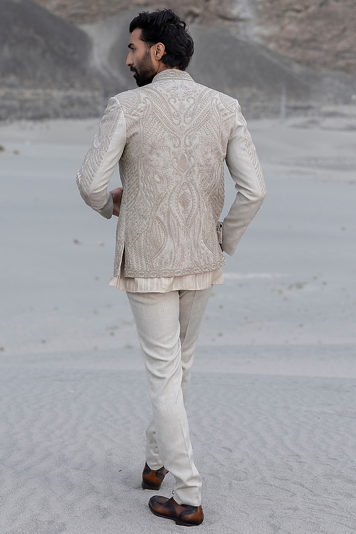Beige Textured Poly Knit Embroidered Groom Indowestern Set by AMIT ARORA at Pernia's Pop Up Shop