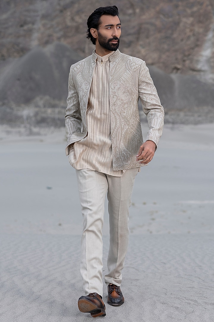Beige Textured Poly Knit Embroidered Groom Indowestern Set by AMIT ARORA at Pernia's Pop Up Shop