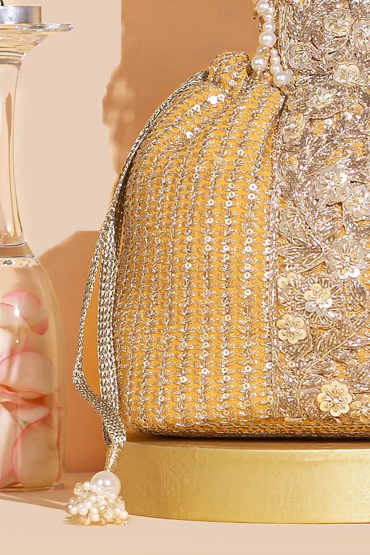 Light Orange Georgette & Poly Silk Sequins Embellished Bucket Bag by AMYRA at Pernia's Pop Up Shop
