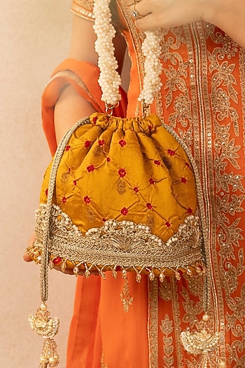 Mustard Bandhani Silk Tie-Dye Bucket Bag by AMYRA at Pernia's Pop Up Shop
