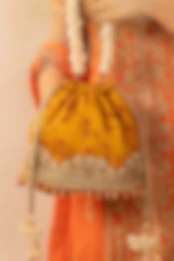 Mustard Bandhani Silk Tie-Dye Bucket Bag by AMYRA at Pernia's Pop Up Shop