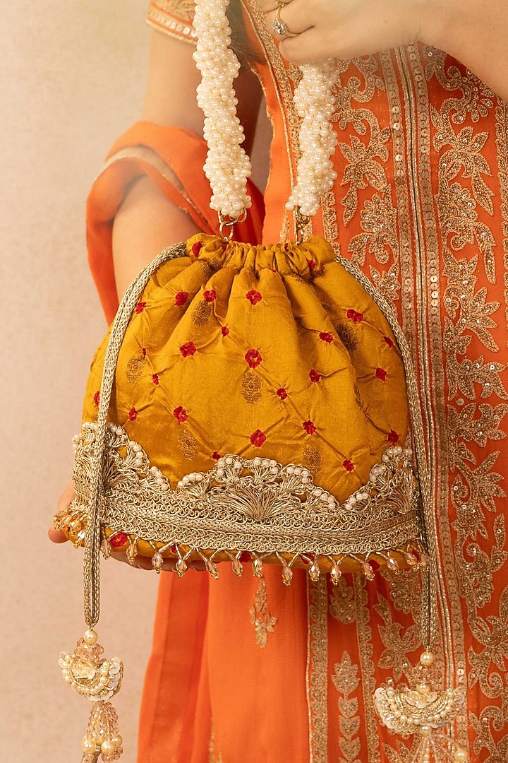 Mustard Bandhani Silk Tie-Dye Bucket Bag by AMYRA at Pernia's Pop Up Shop