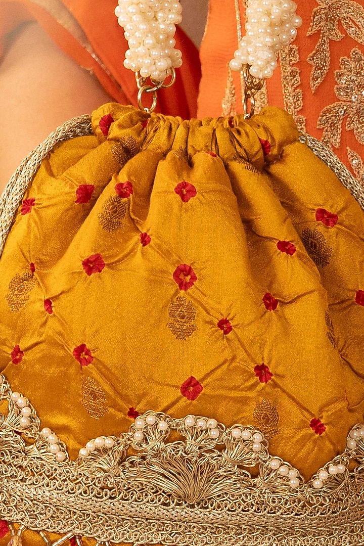 Mustard Bandhani Silk Tie-Dye Bucket Bag by AMYRA at Pernia's Pop Up Shop