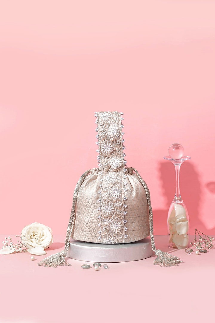 Silver Banarasi Zari Thread Tassel & Lace Embroidered Bucket Bag by AMYRA at Pernia's Pop Up Shop