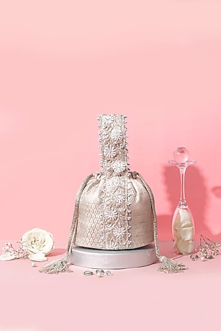 Silver Banarasi Zari Thread Tassel & Lace Embroidered Bucket Bag by AMYRA