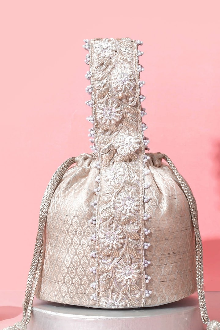 Silver Banarasi Zari Thread Tassel & Lace Embroidered Bucket Bag by AMYRA at Pernia's Pop Up Shop