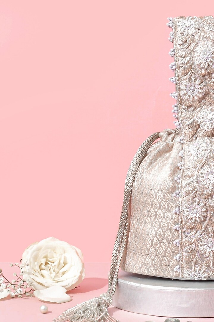 Silver Banarasi Zari Thread Tassel & Lace Embroidered Bucket Bag by AMYRA at Pernia's Pop Up Shop
