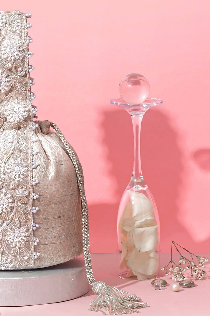 Silver Banarasi Zari Thread Tassel & Lace Embroidered Bucket Bag by AMYRA at Pernia's Pop Up Shop