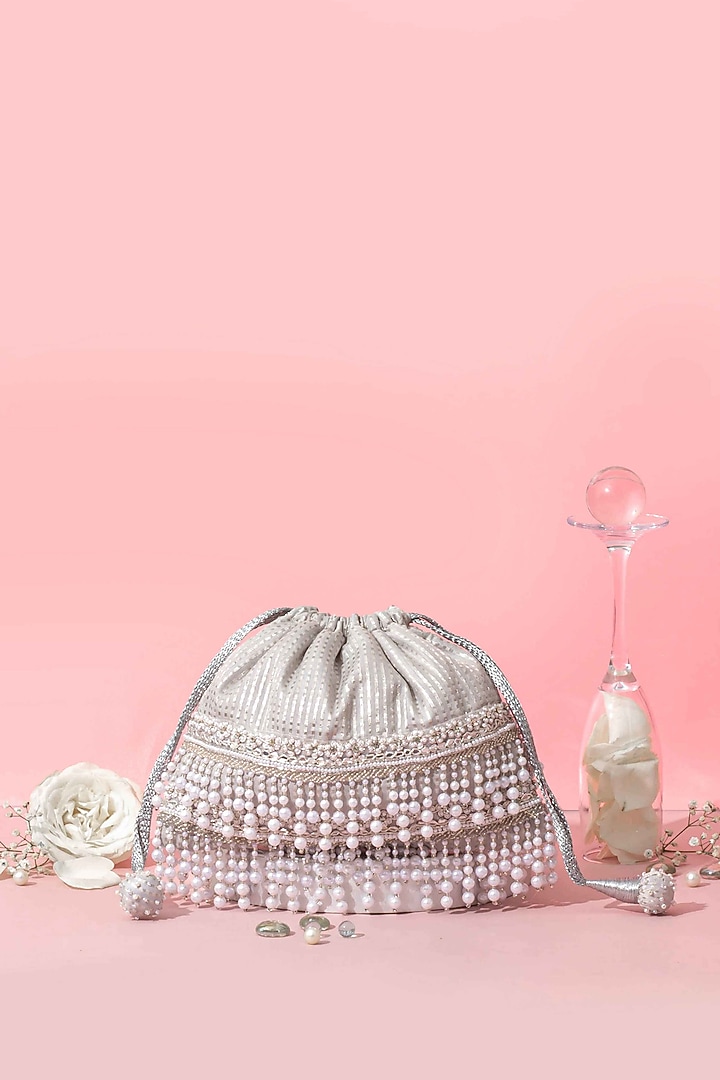 Silver Banarasi Pearl Embellished Potli by AMYRA at Pernia's Pop Up Shop