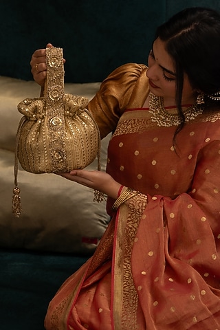 Gold Georgette Mirror Embroidered Round Potli by AMYRA