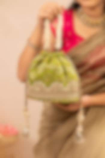 Green Bandhani Silk Lace Embellished Bucket Bag by AMYRA at Pernia's Pop Up Shop