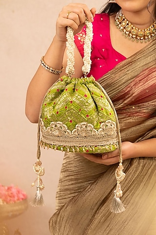 Green Bandhani Silk Lace Embellished Bucket Bag by AMYRA