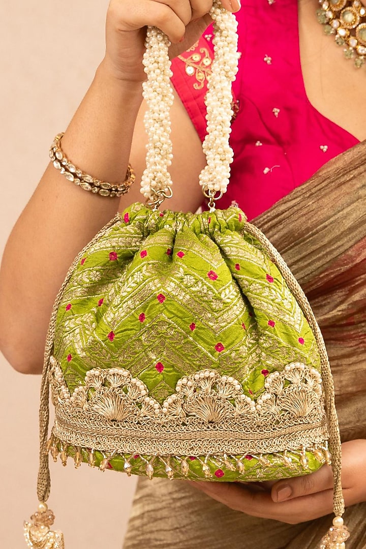 Green Bandhani Silk Lace Embellished Bucket Bag by AMYRA at Pernia's Pop Up Shop