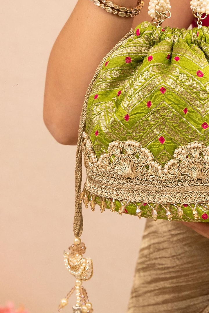 Green Bandhani Silk Lace Embellished Bucket Bag by AMYRA at Pernia's Pop Up Shop