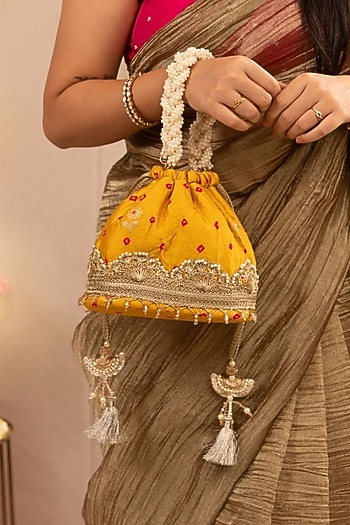 Mustard Bandhani Silk Lace Embellished Bucket Bag by AMYRA at Pernia's Pop Up Shop