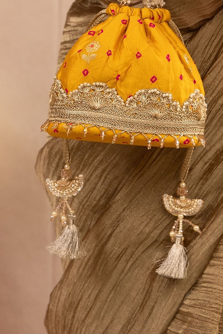 Mustard Bandhani Silk Lace Embellished Bucket Bag by AMYRA at Pernia's Pop Up Shop