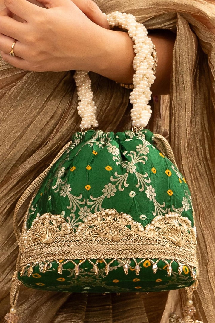 Green Bandhani Silk Lace Embellished Bucket Bag by AMYRA at Pernia's Pop Up Shop