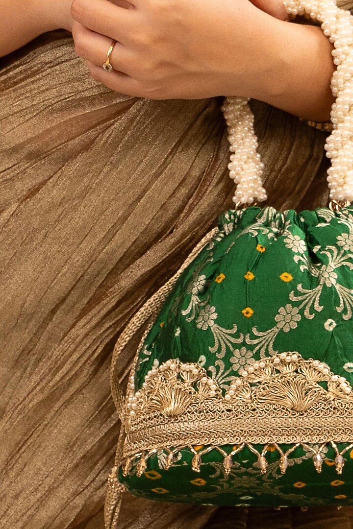 Green Bandhani Silk Lace Embellished Bucket Bag by AMYRA at Pernia's Pop Up Shop