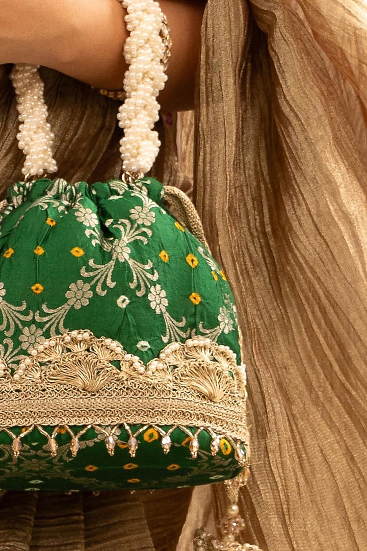 Green Bandhani Silk Lace Embellished Bucket Bag by AMYRA at Pernia's Pop Up Shop