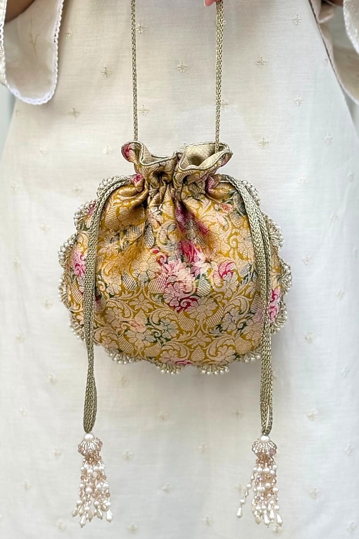 Mustard Pure Banarasi Silk Pearl Embellished Potli by AMYRA at Pernia's Pop Up Shop