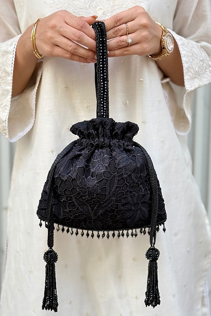 Black Organza Cutwork Potli by AMYRA at Pernia's Pop Up Shop