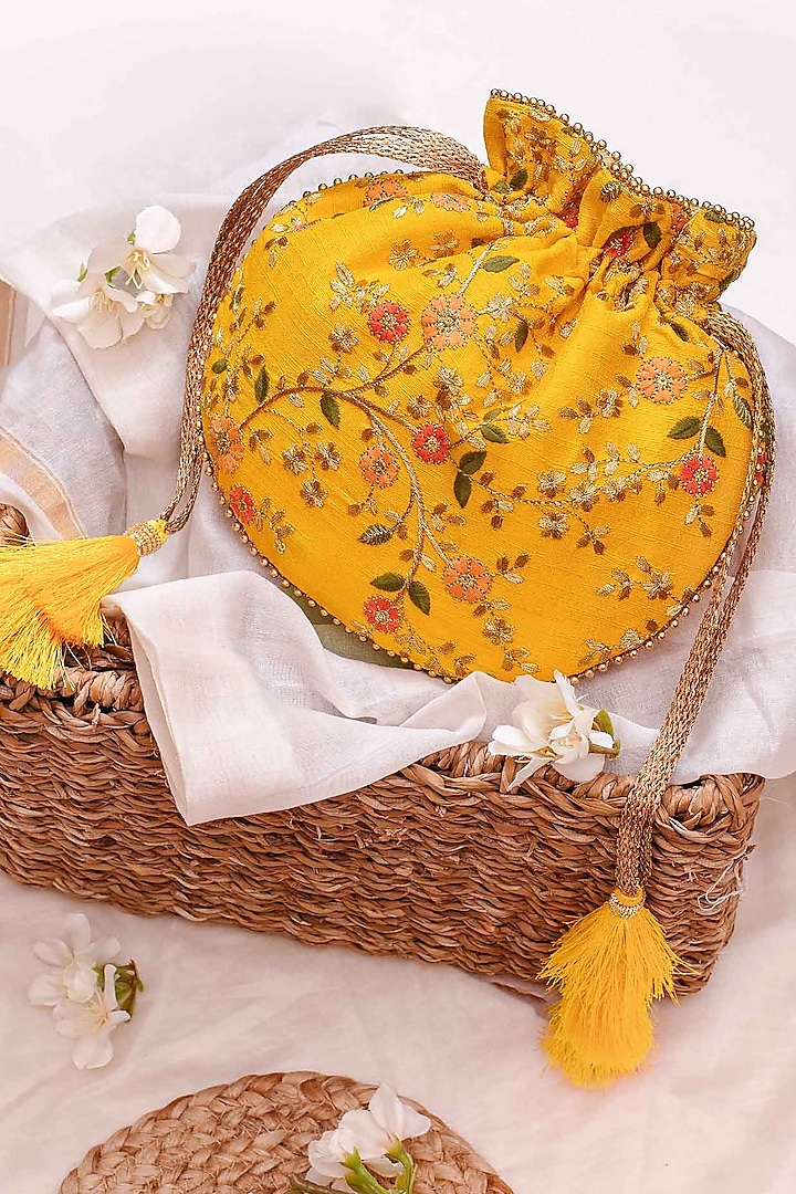 Yellow Poly Silk Embroidered Potli by AMYRA