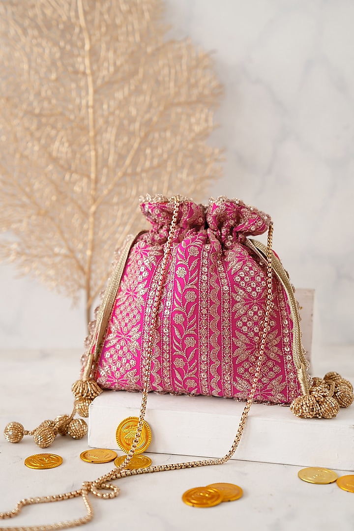 Pink Poly Silk Embroidered Potli Bag by AMYRA