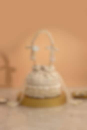 Off-White Poly Silk Cutdana Embellished Potli by AMYRA at Pernia's Pop Up Shop