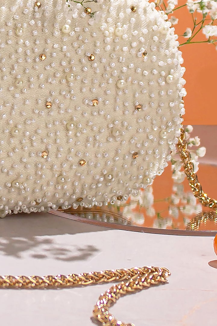 White Poly Silk Embroidered Clutch by AMYRA at Pernia's Pop Up Shop
