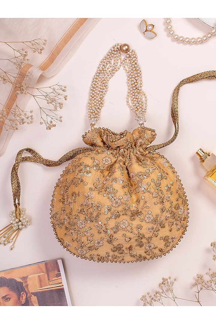 Beige Silk Embroidered Potli by AMYRA at Pernia's Pop Up Shop