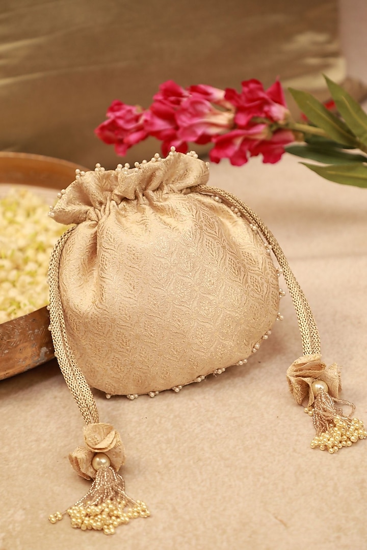 Ivory Banarasi Fabric Cutdana Embroidered Potli by AMYRA at Pernia's Pop Up Shop