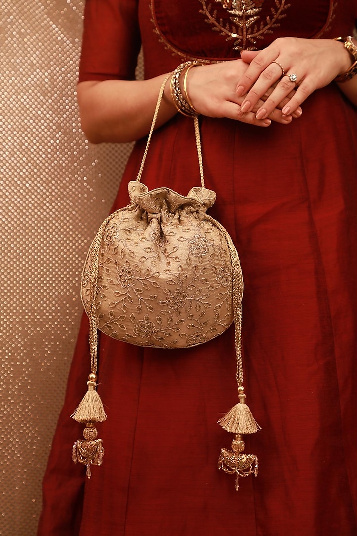 Gold Tissue Cutwork Thread Embroidered Potli by AMYRA at Pernia's Pop Up Shop