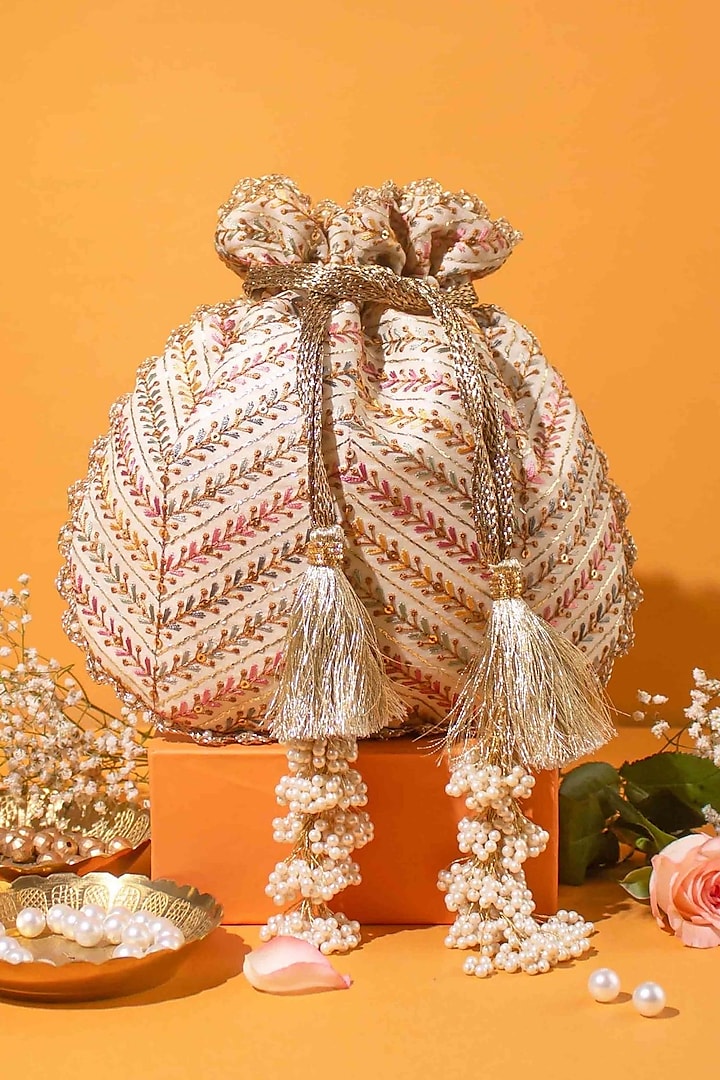 Off-White Poly Silk Golden Thread Embroidered Potli Bag by AMYRA at Pernia's Pop Up Shop