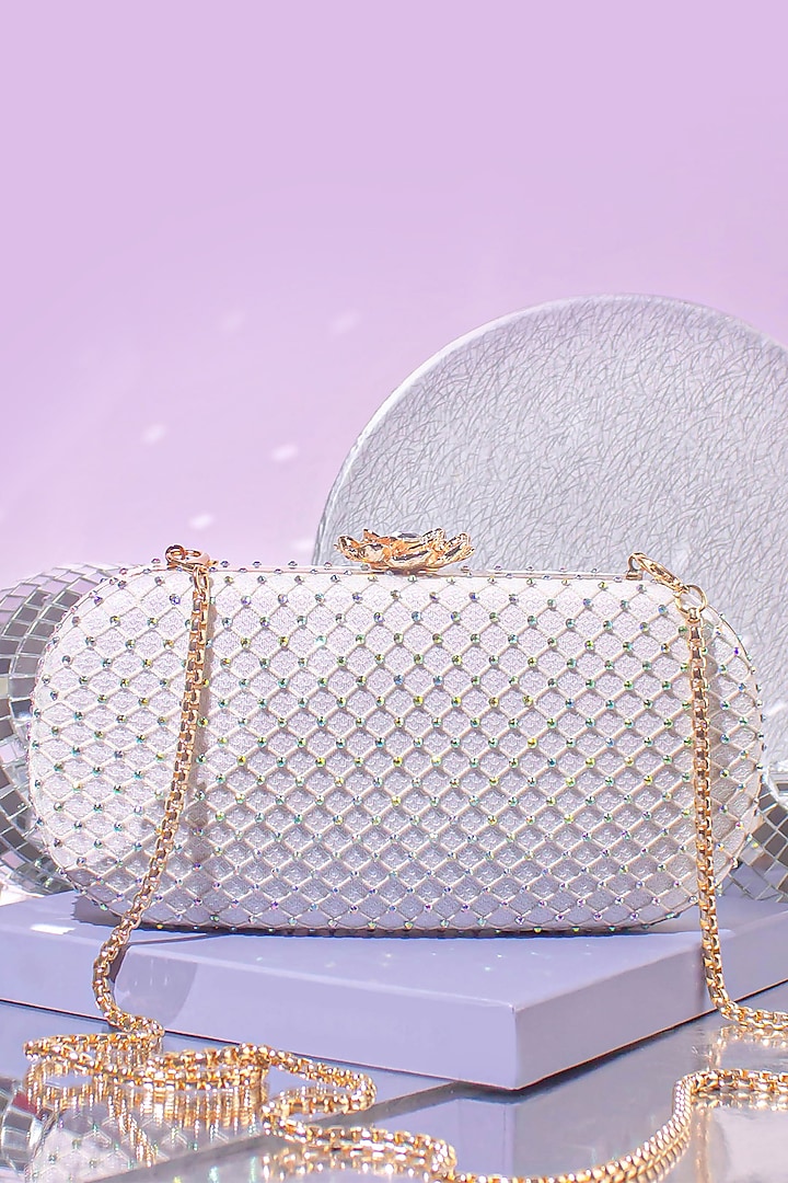 Off White Shimmer Clutch by AMYRA