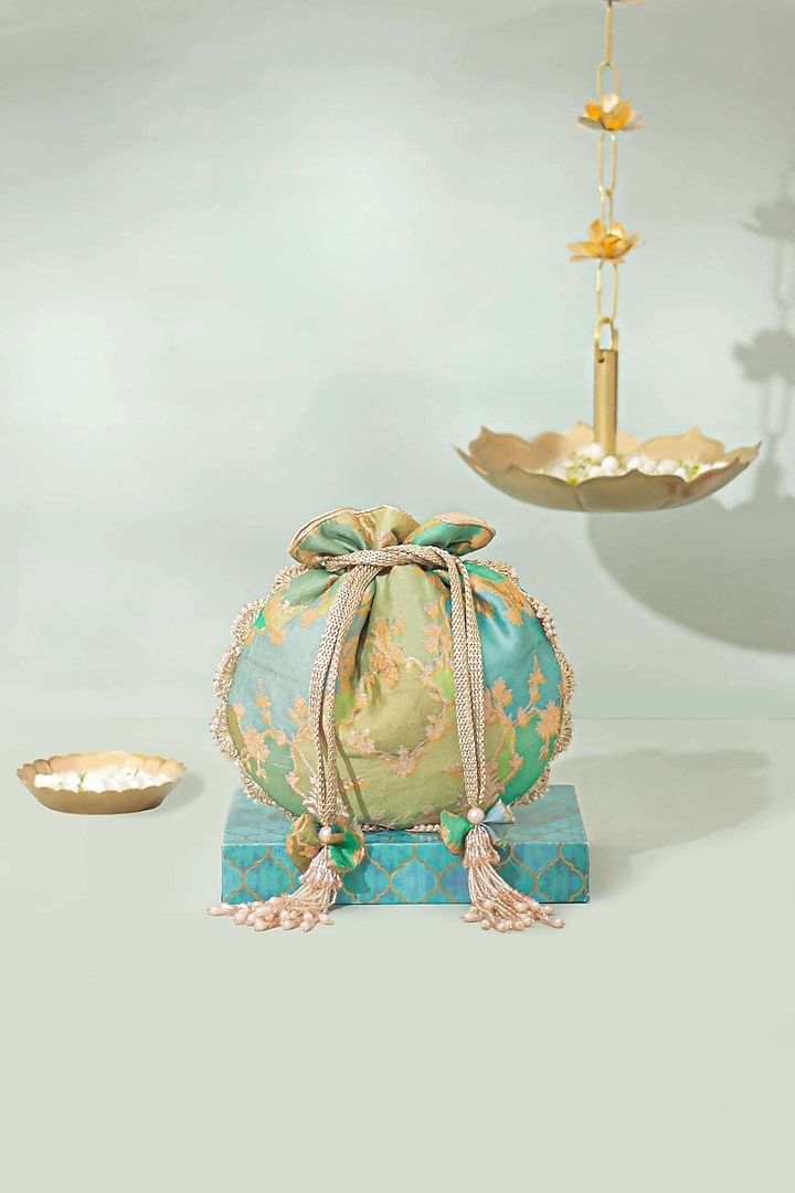 Green Pure Banarasi Silk Pearl Embellished Potli by AMYRA at Pernia's Pop Up Shop