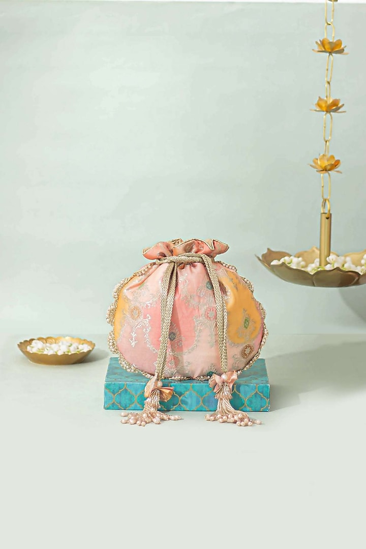 Peach Pure Banarasi Silk Pearl Embellished Potli by AMYRA at Pernia's Pop Up Shop