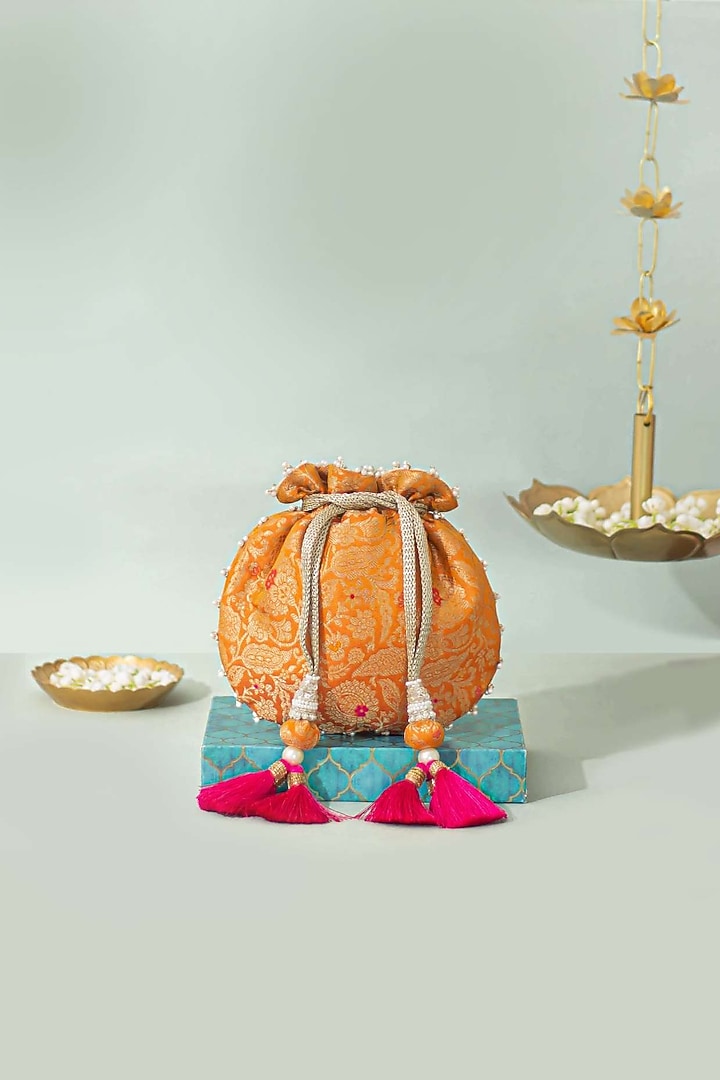 Orange Pure Banarasi Silk Pearl Embellished Potli by AMYRA at Pernia's Pop Up Shop