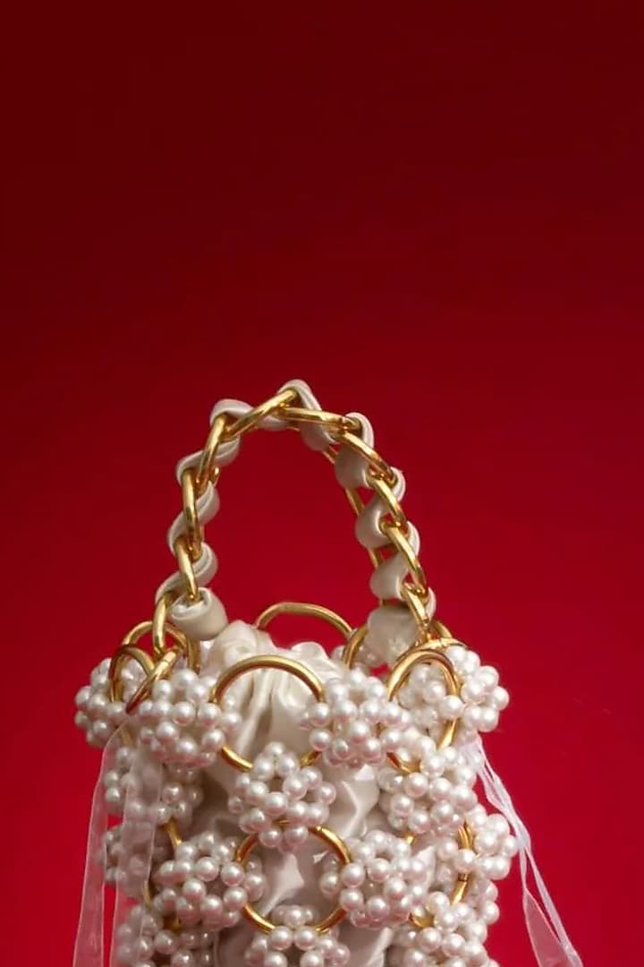 Off-White Hand-Selected Pearl Bucket Bag by AMYRA at Pernia's Pop Up Shop