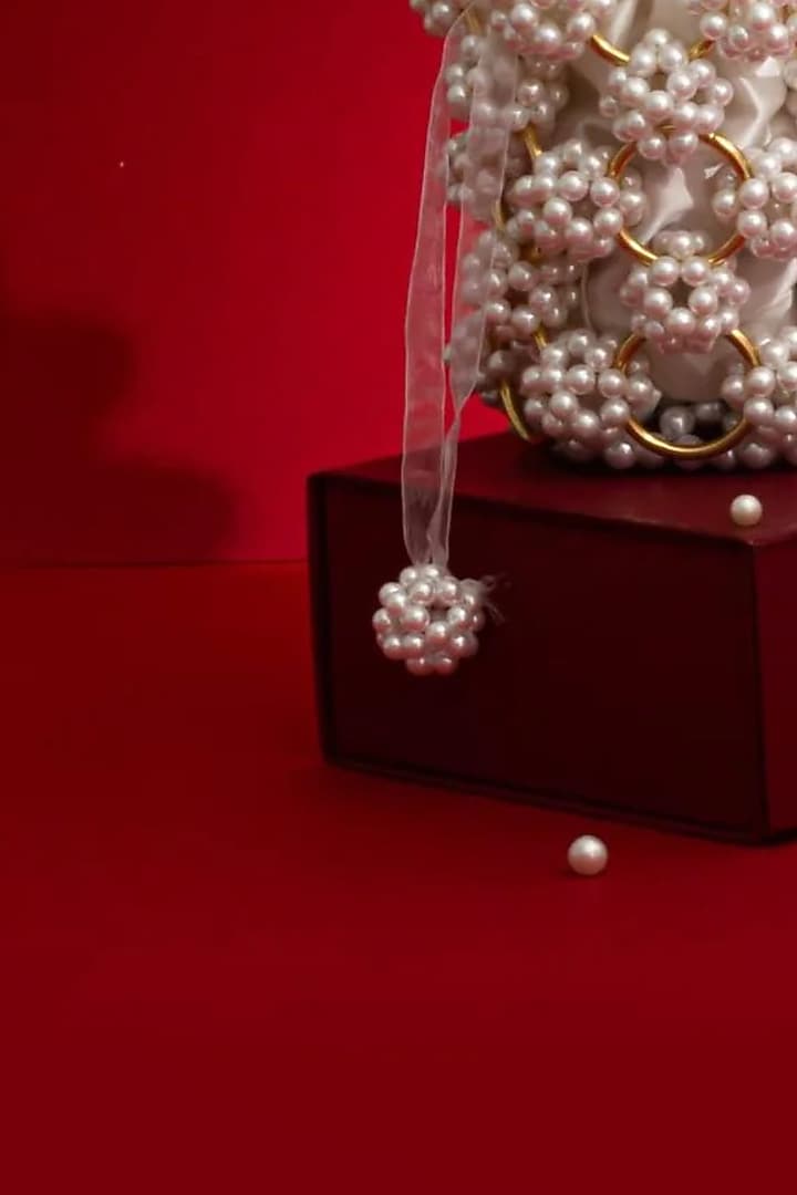 Off-White Hand-Selected Pearl Bucket Bag by AMYRA at Pernia's Pop Up Shop