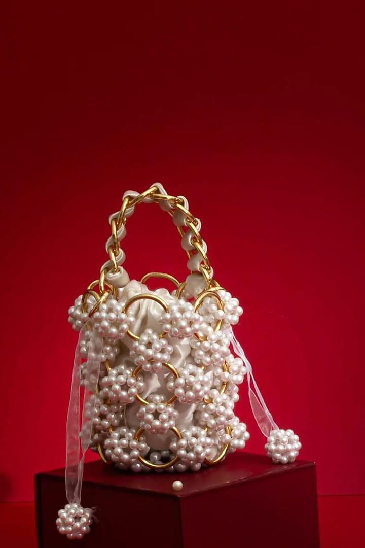 Off-White Hand-Selected Pearl Bucket Bag by AMYRA at Pernia's Pop Up Shop
