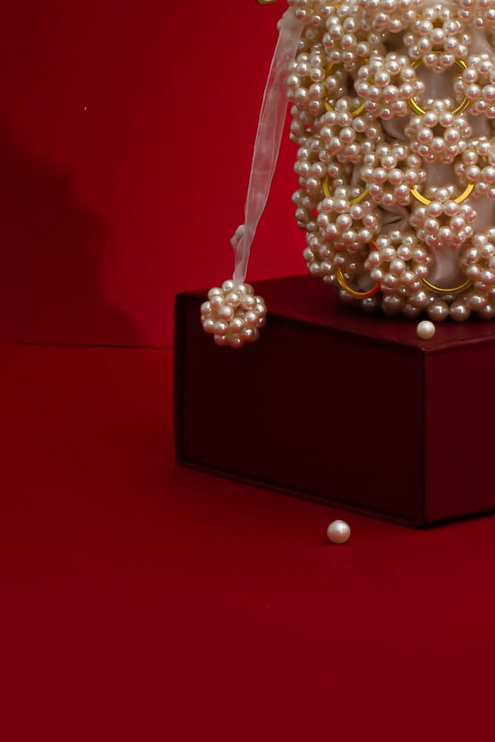 Off-White Hand-Selected Pearl Bucket Bag by AMYRA at Pernia's Pop Up Shop