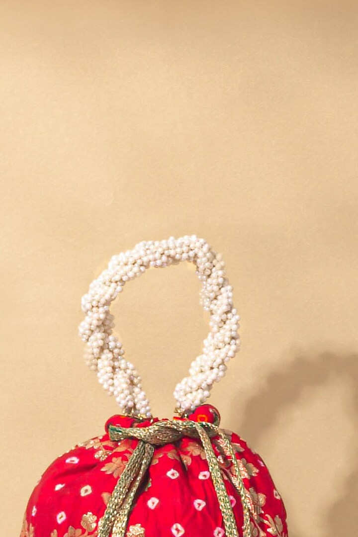 Red Bandhani Silk Bucket Bag by AMYRA at Pernia's Pop Up Shop