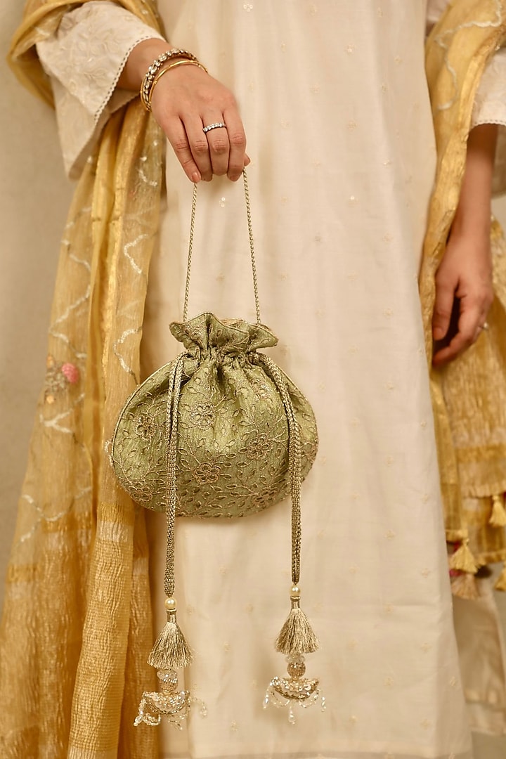 Green Tissue Cutwork & Zari Thread Embroidered Potli by AMYRA at Pernia's Pop Up Shop