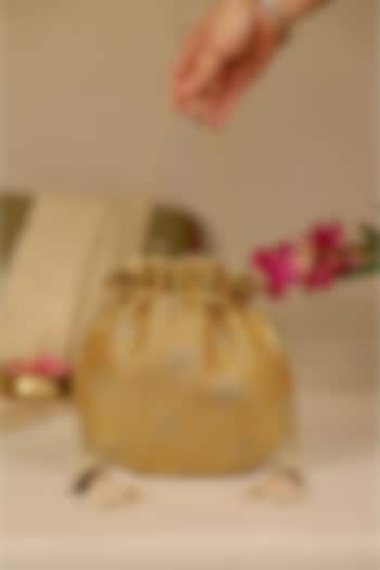 Mustard Tissue Cutwork & Zari Thread Embroidered Potli by AMYRA at Pernia's Pop Up Shop