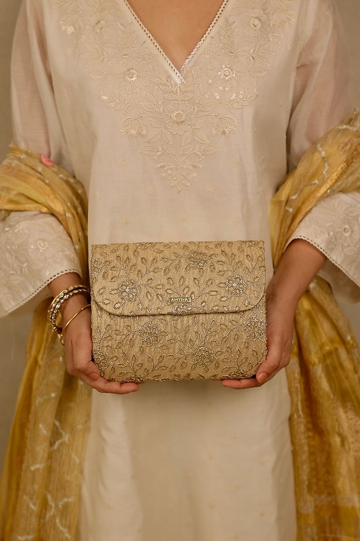 Gold Tissue Cutwork & Zari Thread Embroidered Flapover Bag by AMYRA at Pernia's Pop Up Shop